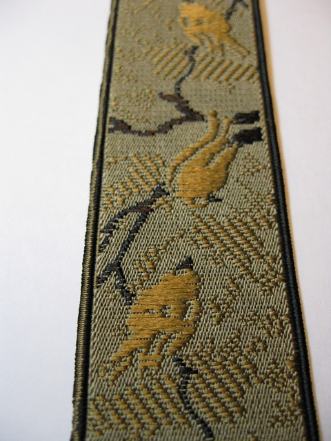 AVIARY DESIGN 1 1/3" X 48" "Y" STYLE GOLD AND BLACK COLOR ON KHAKI TAN BACKGROUND WITH BLACK TRIM ON EDGES. DELUXE SUSPENDERS.WITH 3 GOLD GRIPS AND 2 LENGTH ADUSTERS YD-AVI76B48#131g